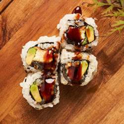 4 Sushi Rolls on Wood Plank